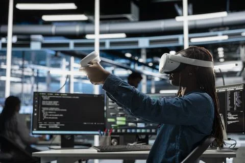 Data center developer uses VR headset and AI technology for machine learning Stock Photos