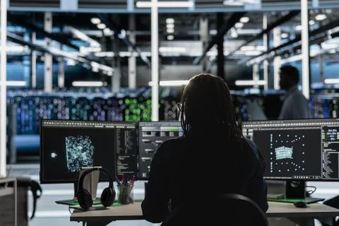 Data center developer using AI visualization tools to identify errors Stock Photos