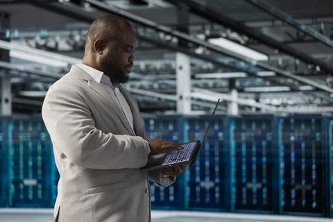 Data center employee running predictive maintenance scans Stock Photos