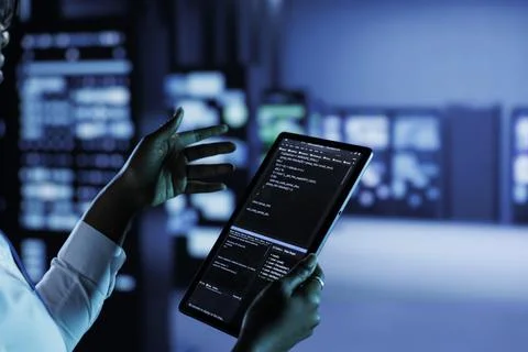 Data center employee runs code 写真素材