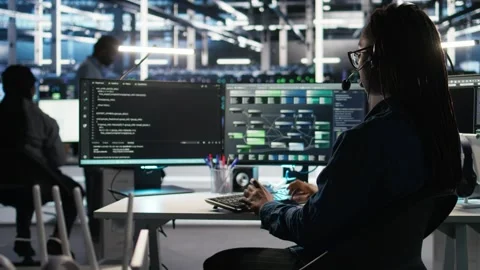 Data center employee uses audio headset to troubleshoot client reported issues Stock Footage 309511469