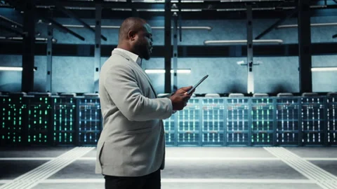 Data center engineer adjusting blade server hardware Stock Footage 311833410