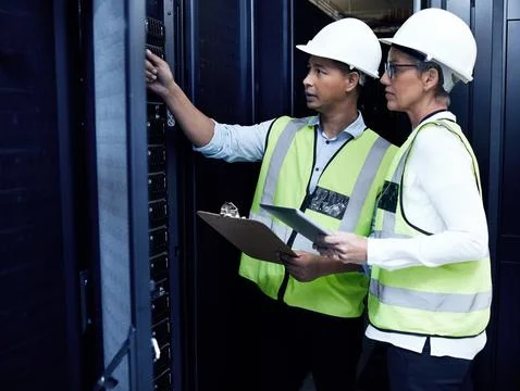 Data center, engineer and tablet for maintenance, safety and checklist as Foto stock
