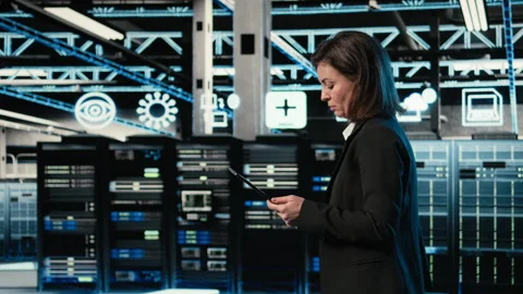 Data center engineer configuring rigs using augmented reality control panel Stock Footage 329323678