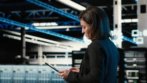 Data center engineer configuring rigs using augmented reality control panel Stock Footage 329326955