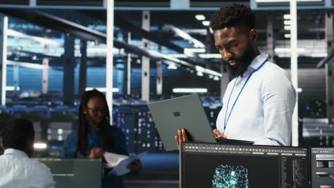 Data center engineer does node tree programming to optimize resource allocation Stock Footage 307019426