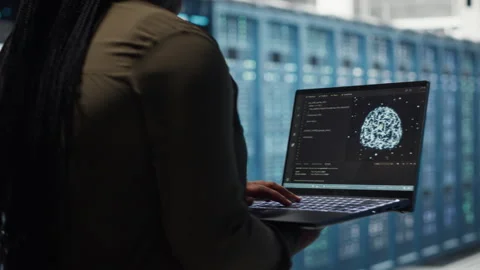 Data center engineer doing AI data analysis on laptop to upgrade infrastructure Stock Footage 317126738