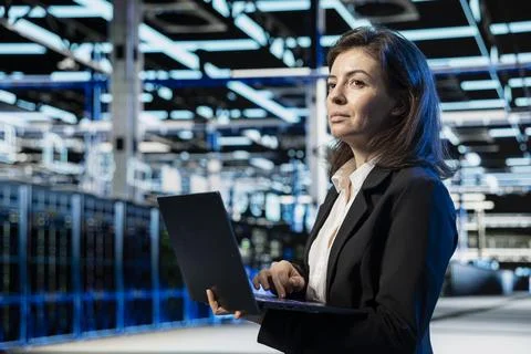 Data center engineer doing digital twin scan of supercomputer Stock Photos
