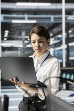 Data center engineer doing software updates on laptop Stock Photos