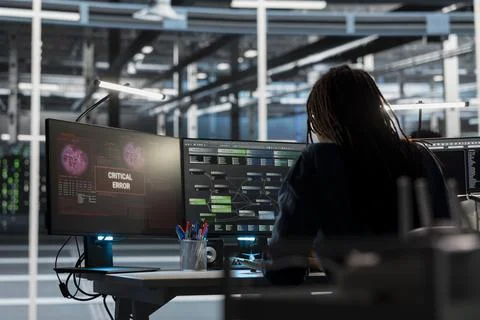 Data center engineer finding error in equipment used for machine learning Stock Photos