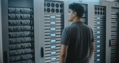 Data Center Engineer Interacting With Server Rack Controls During Stock Footage 344953744