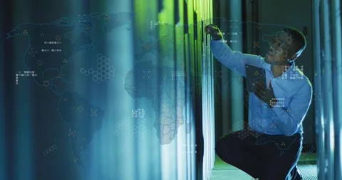Data center engineer kneeling using tablet and activating HUD map while checking Stock Footage 331235515