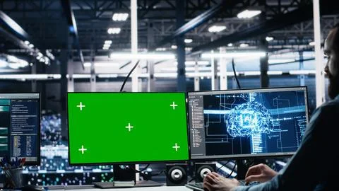 Data center engineer managing AI systems for uptime using mockup PC Stock Photos