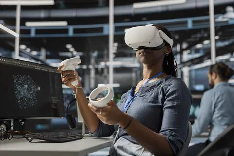 Data center engineer running diagnostic scripts using VR headset Stock Photos