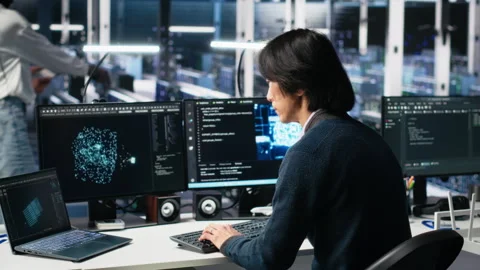 Data center engineer system administrator AI systems for uptime and efficiency Stock Footage 313568562