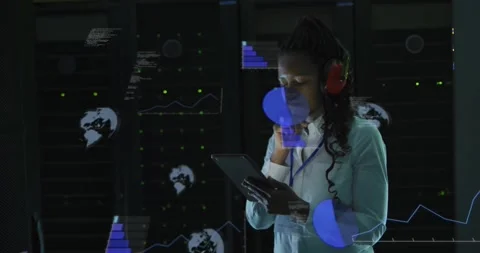 Data center engineer tapping tablet and generating holographic graph and code 動画素材 328466911