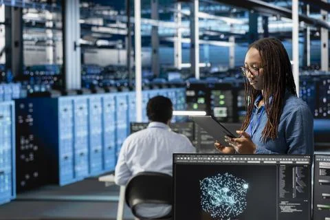 Data center engineer uses AI visualization tool on tablet Stock Photos