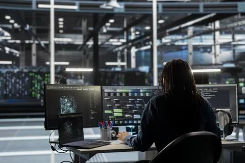 Data center engineer uses AI visual programming to oversee automated tasks 写真素材