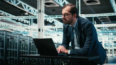 Data center engineer uses laptop and augmented reality simulation Stock Footage 329452561