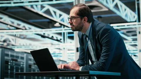 Data center engineer uses laptop and augmented reality simulation Stock Footage 329650537