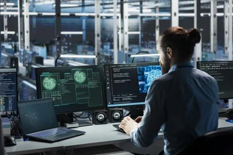 Data center engineer using AI assistant to manage global server infrastructure Stock Photos