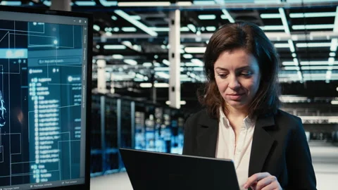 Data center engineer using artificial intelligence tech to optimize server load Stock Footage 329324211