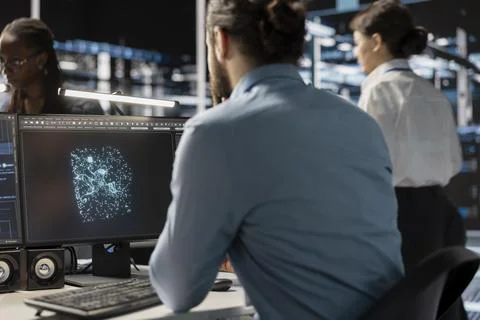 Data center engineer using computer to develop software analyzing neural network Stock Photos