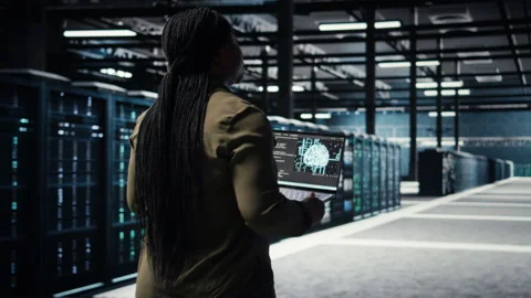 Data center engineer using deep learning on laptop to optimize operations Stock Footage 317126494