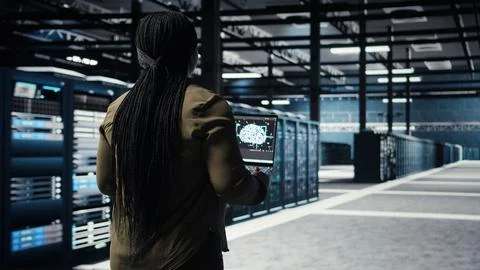 Data center engineer using deep learning on laptop to optimize operations Stock Photos