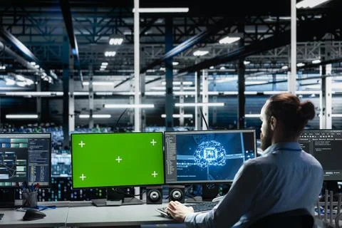 Data center engineer using green screen computer to run AI forecasting Stock Photos