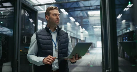 Data Center Engineer Using Laptop Computer Stock Footage 319995253