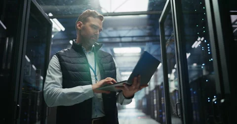 Data Center Engineer Using Laptop Computer Stock Footage 319995292