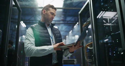 Data Center Engineer Using Laptop Computer Stock Footage 319995522