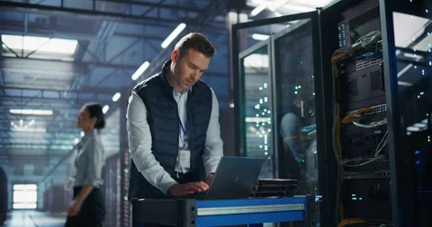Data Center Engineer Using Laptop Computer Stock Footage 320000502