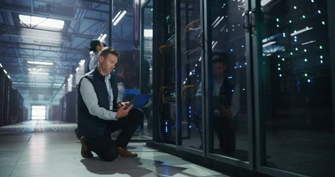 Data Center Engineer Using Laptop Computer Stock Footage 320001035