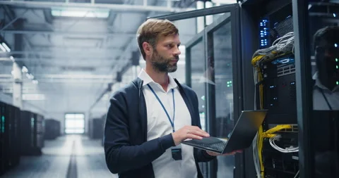 Data Center Engineer Using Laptop Computer Stock Footage 320867385
