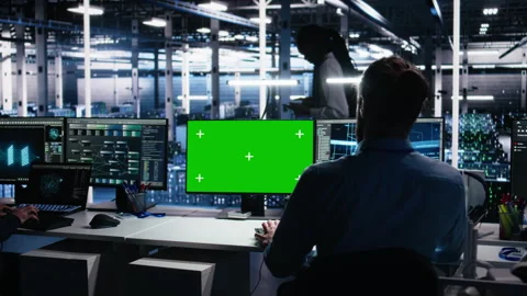 Data center engineer using machine learning algorithms on green screen PC Stock-Footage 313569500