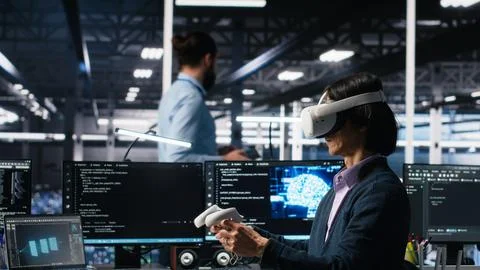 Data center engineer using virtual reality, managing AI systems Stock Photos
