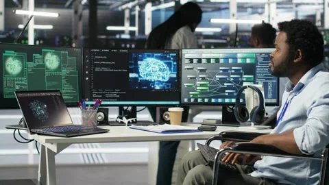 Data center engineer in wheelchair and coworkers fighting security breach Stock Footage 309508461
