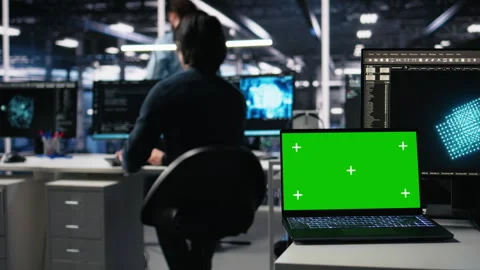 Data center engineer working on neural network on chroma key laptop Stock Footage 313566831