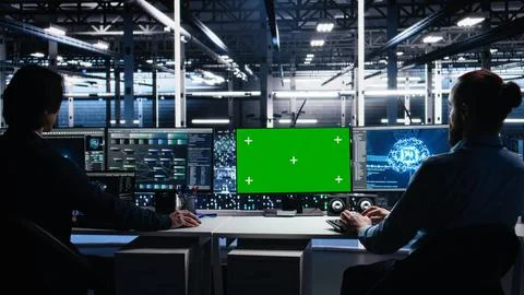 Data center engineer working on neural network on green screen PC Stockfoto's
