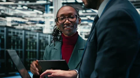 Data center engineering team brainstorming, using AR simulation Stock Footage 329531573