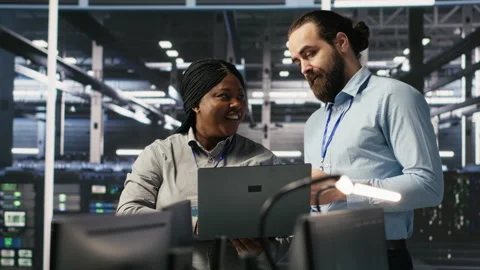 Data center engineering team collaborating on blade servers maintenance Stock Footage 309367607