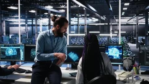 Data center engineering team collaborating on neural network development Video stock 313570688