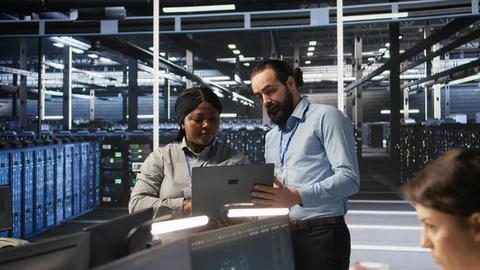 Data center engineering team collaborating on blade servers maintenance Stock Photos