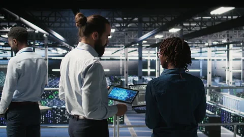 Data center engineering team doing maintenance on AI servers Stock Footage 310278646