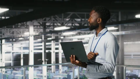 Data center engineering team on industrial platform collaborating Stock Footage 310780872