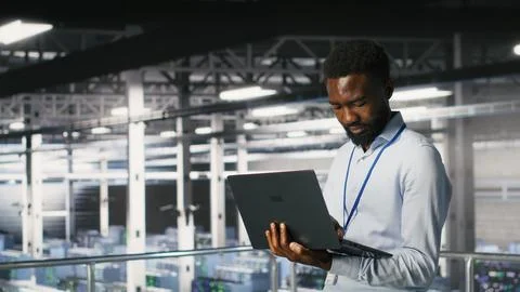 Data center engineering team on industrial platform collaborating Stock Photos
