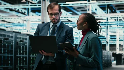 Data center engineering team using AR tech, working together Video stock 329650316