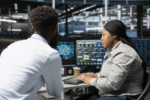 Data center engineering team using artificial intelligence neural networks Stock Photos